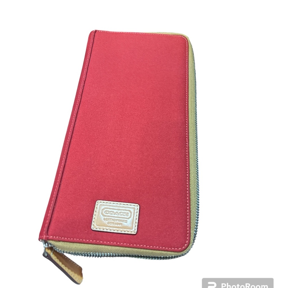 Coach continental zip around wallet. NWOT. Red/rust canvas w/leather interior.
